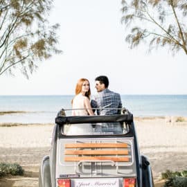 wedding photography bride and groom with a classic car