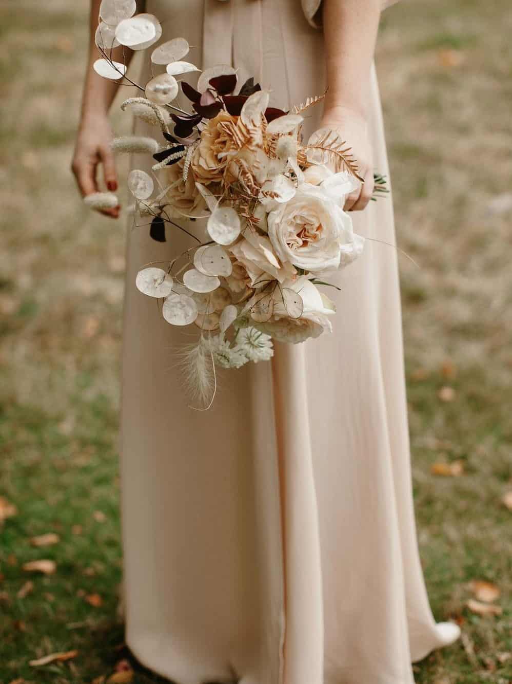 wedding bouquet with white roses and pampas grass
