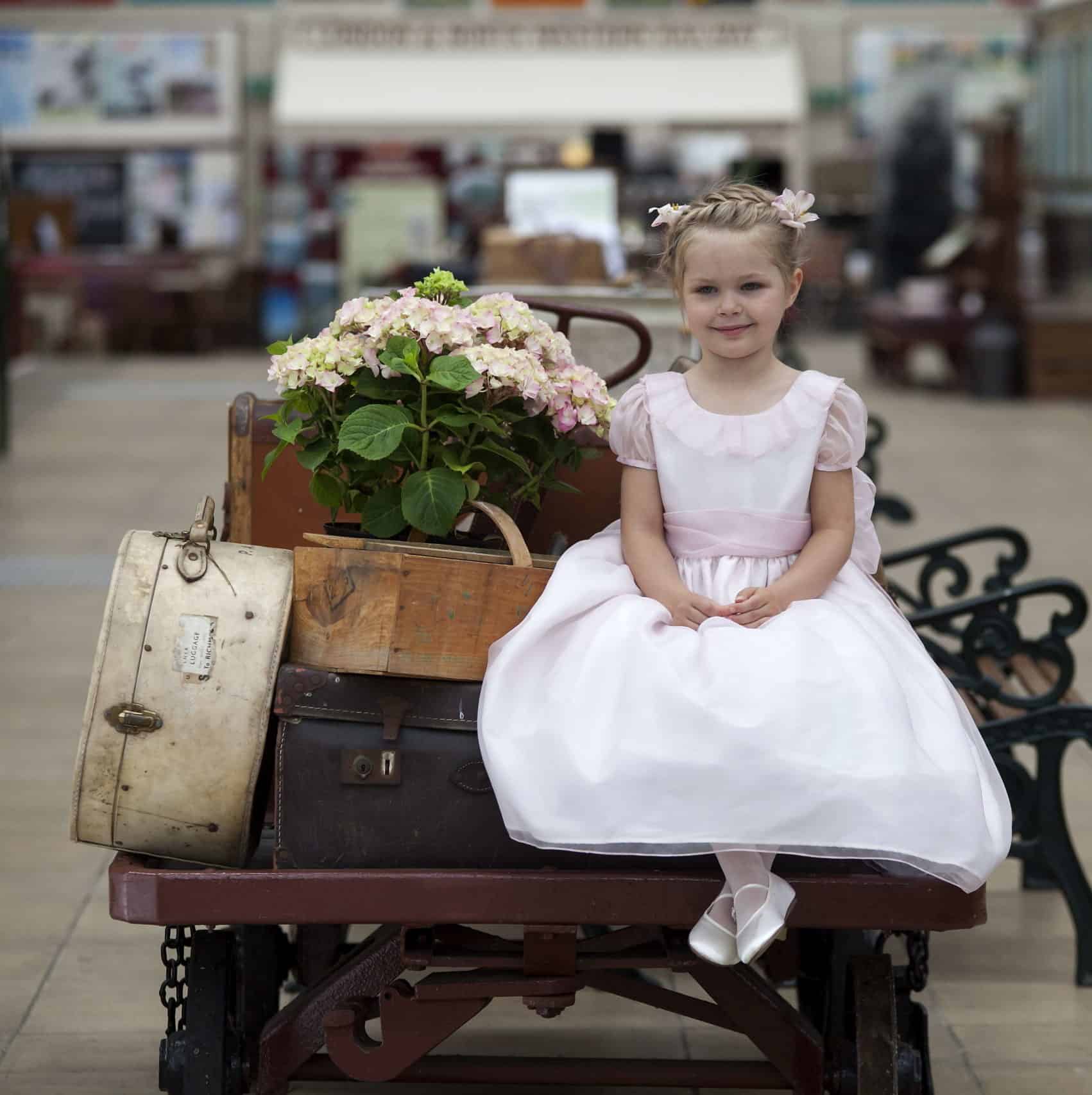 flower girl with classic royal style dress by Nicki Macfarlane