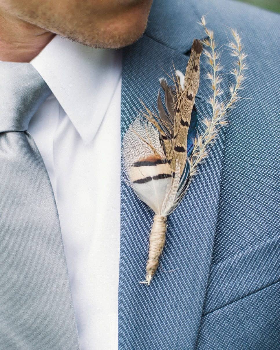 groom boutonniere with feather
