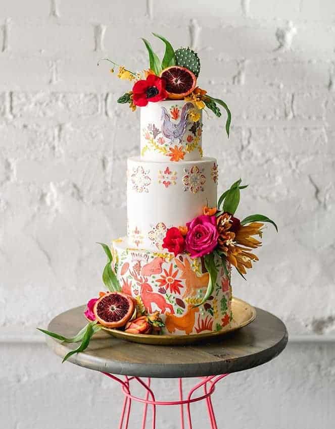 wedding cake with colourful flowers and fruits