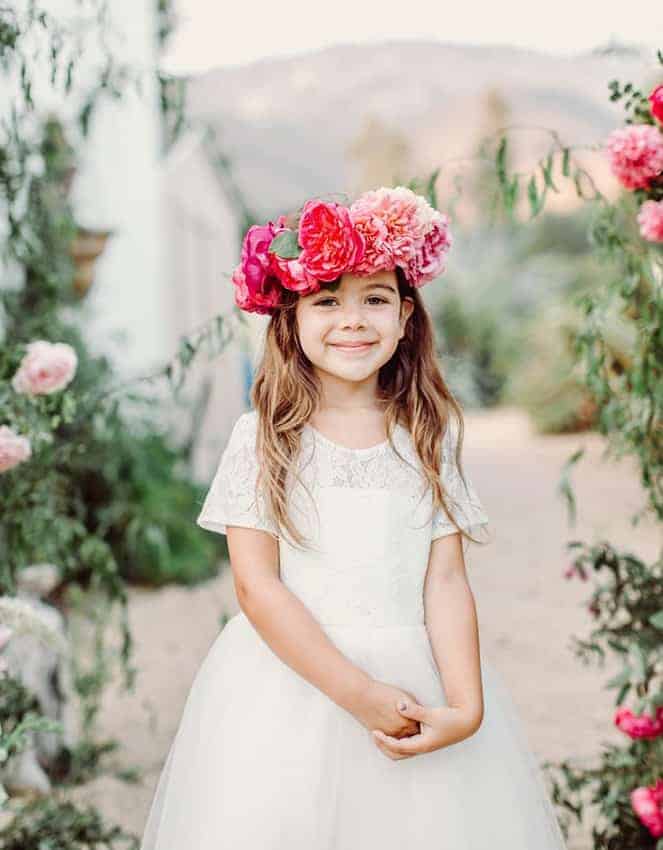 flower girl with a pink floral head peace