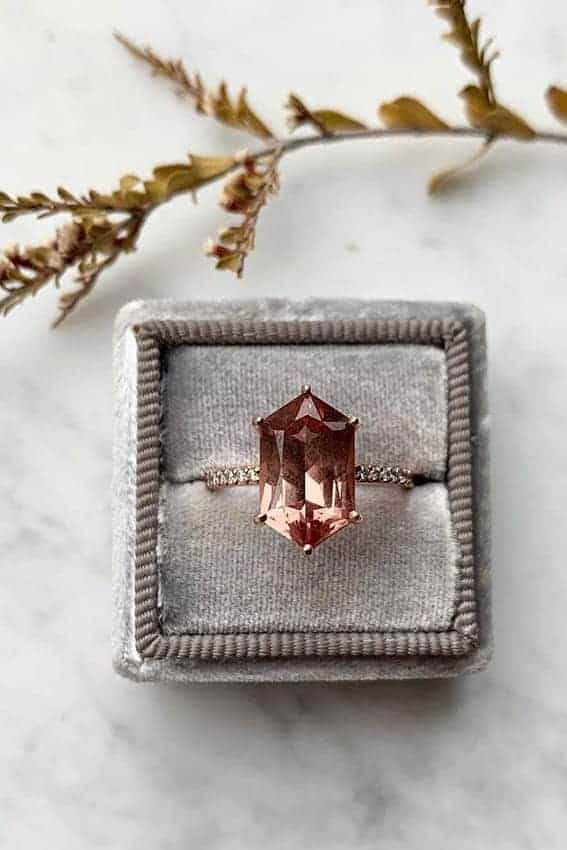 wedding ring with dusty orange diamond