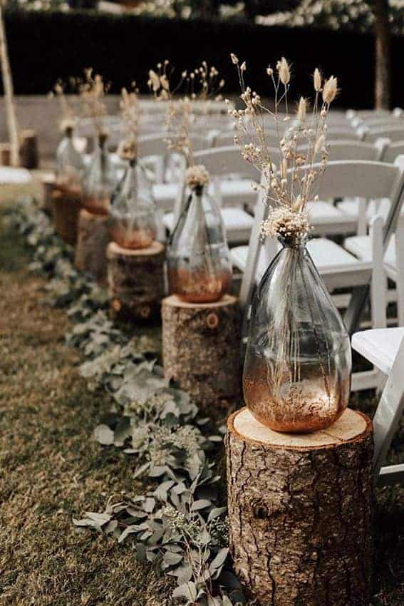 wedding decoration clear bottles with dried flowers