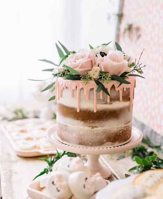 naked wedding cake and pink flowers