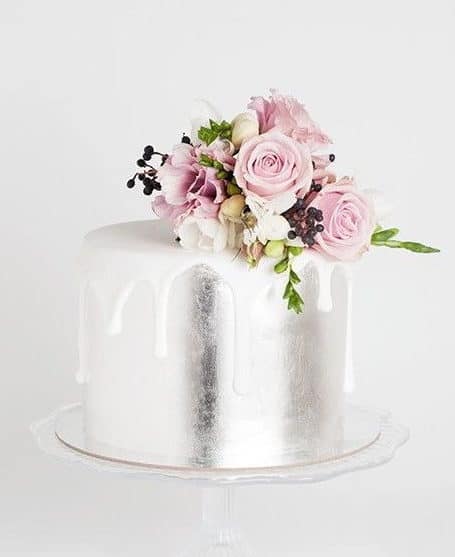 silver wedding cake and roses