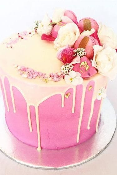 pink wedding cake and macarons