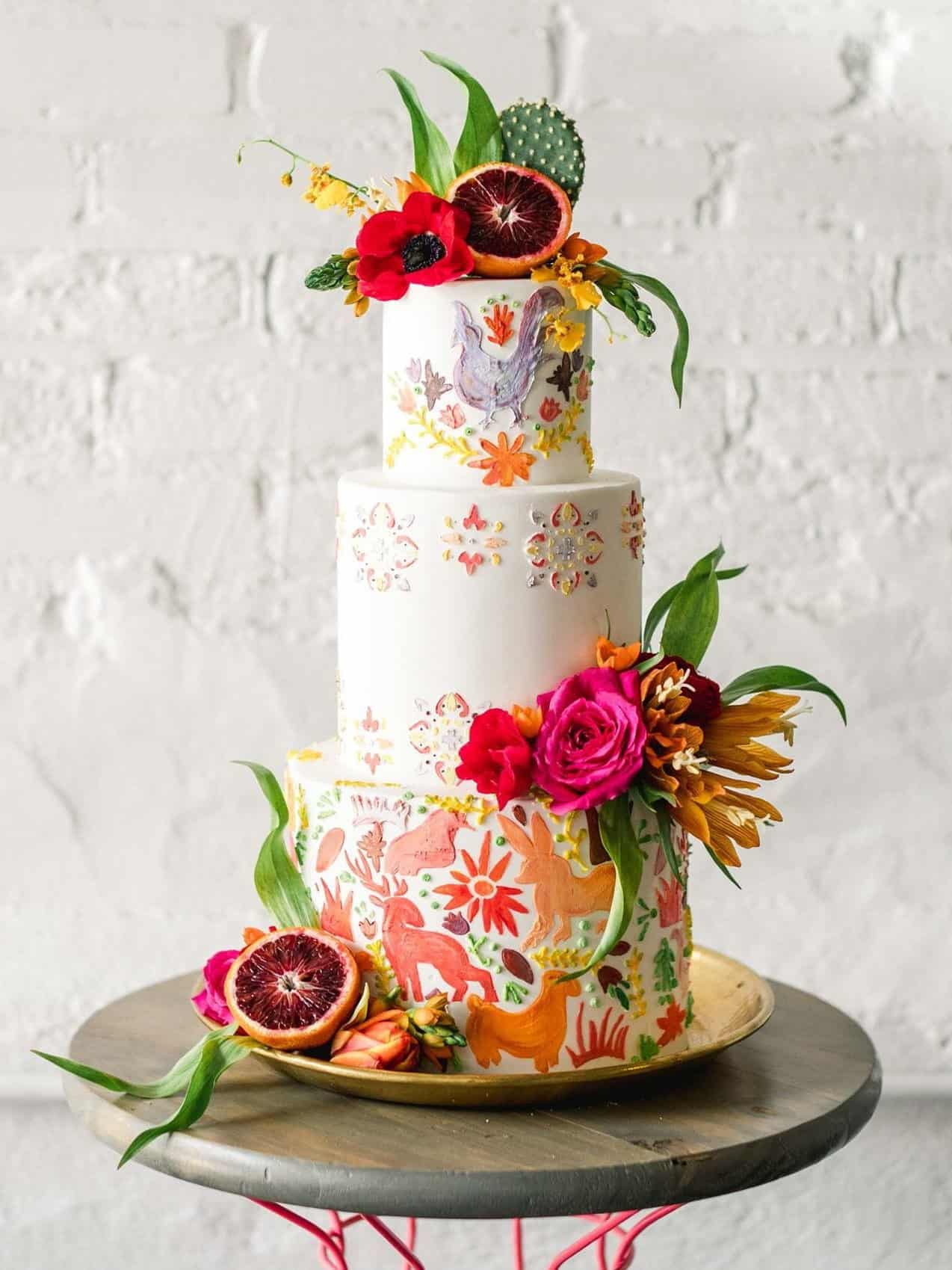 painted wedding cake with cactus flowers and fruits