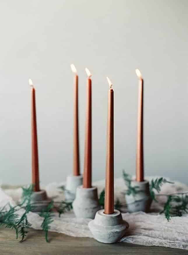 candleholder with concrete and dusty orange candles