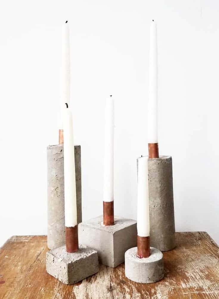 candleholder with concrete with white candles