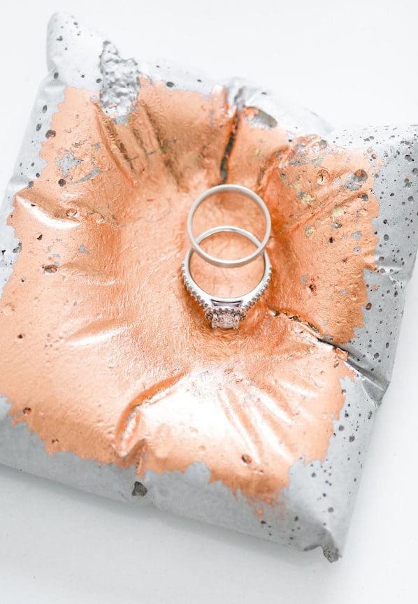 wedding ring in a concrete plate