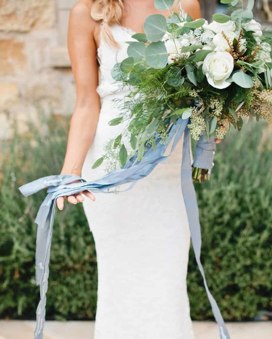 wedding bouquet with white roses and dusty blue ribbon