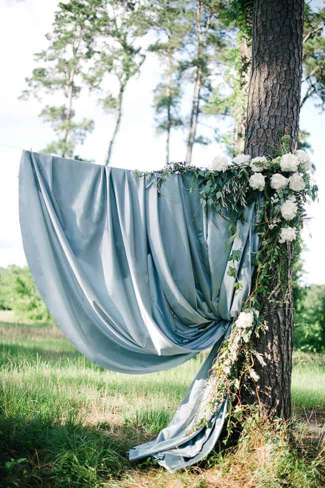 wedding decoration a dusty blue fabric and white flowers