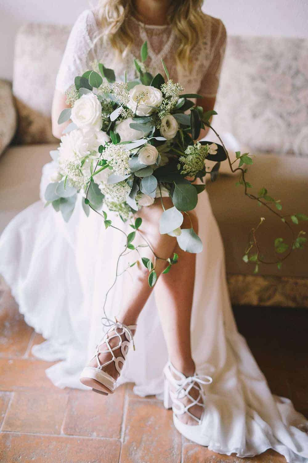 A Tuscan Dream Wedding Come True - photo by Nastja Kovacec http://ruffledblog.com/a-tuscan-dream-wedding-come-true wedding bridal bouquet with with flowers and greenery