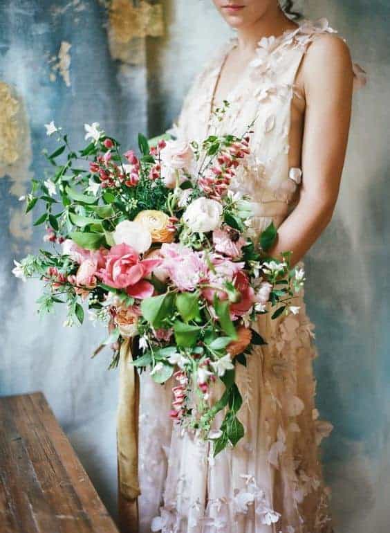 long wedding bouquet with few but striking flowers with long stems