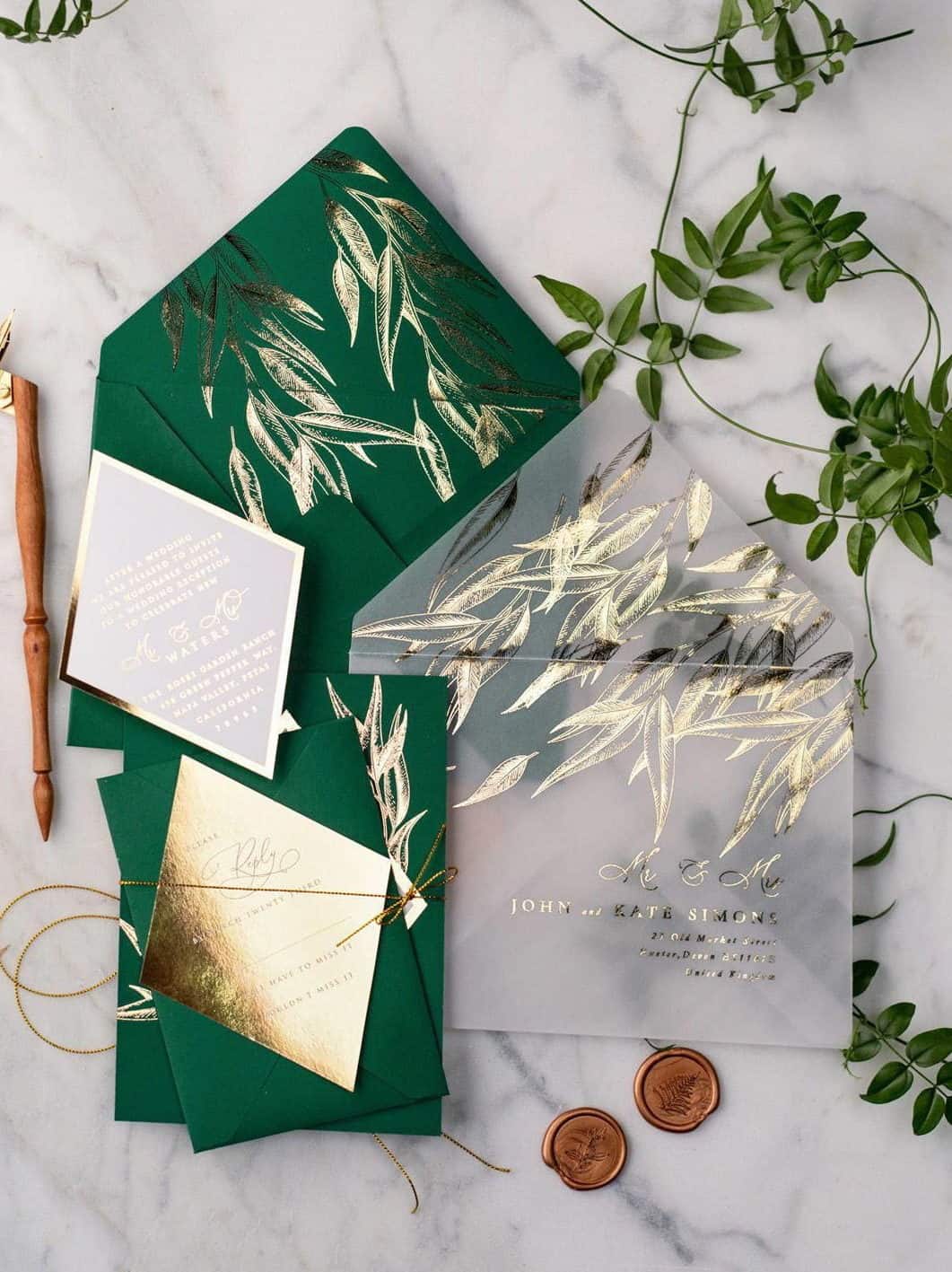 wedding invitation in green and gold foil with transparent envelope
