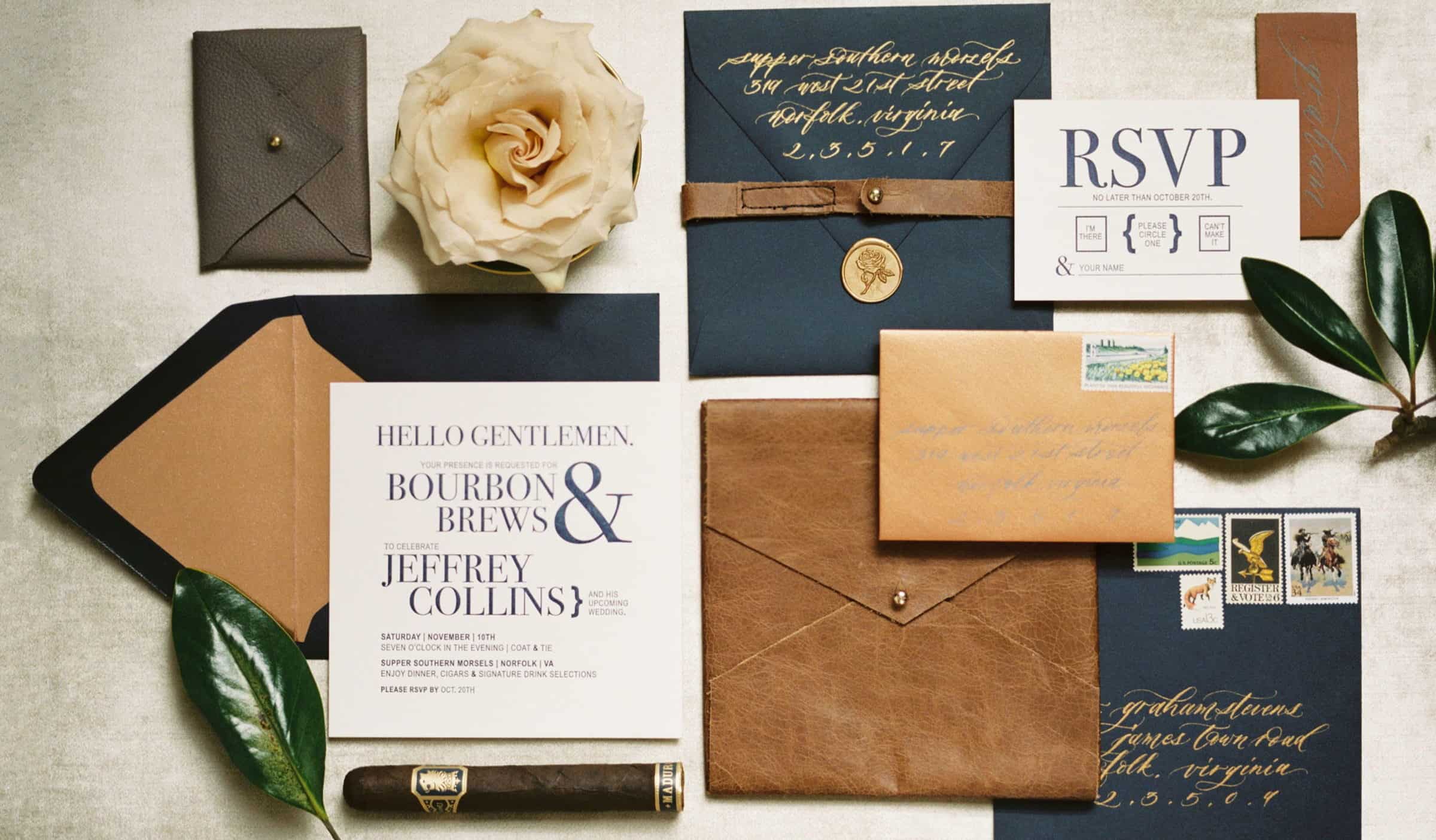 typography wedding invitation with navy blue envelope and leather details