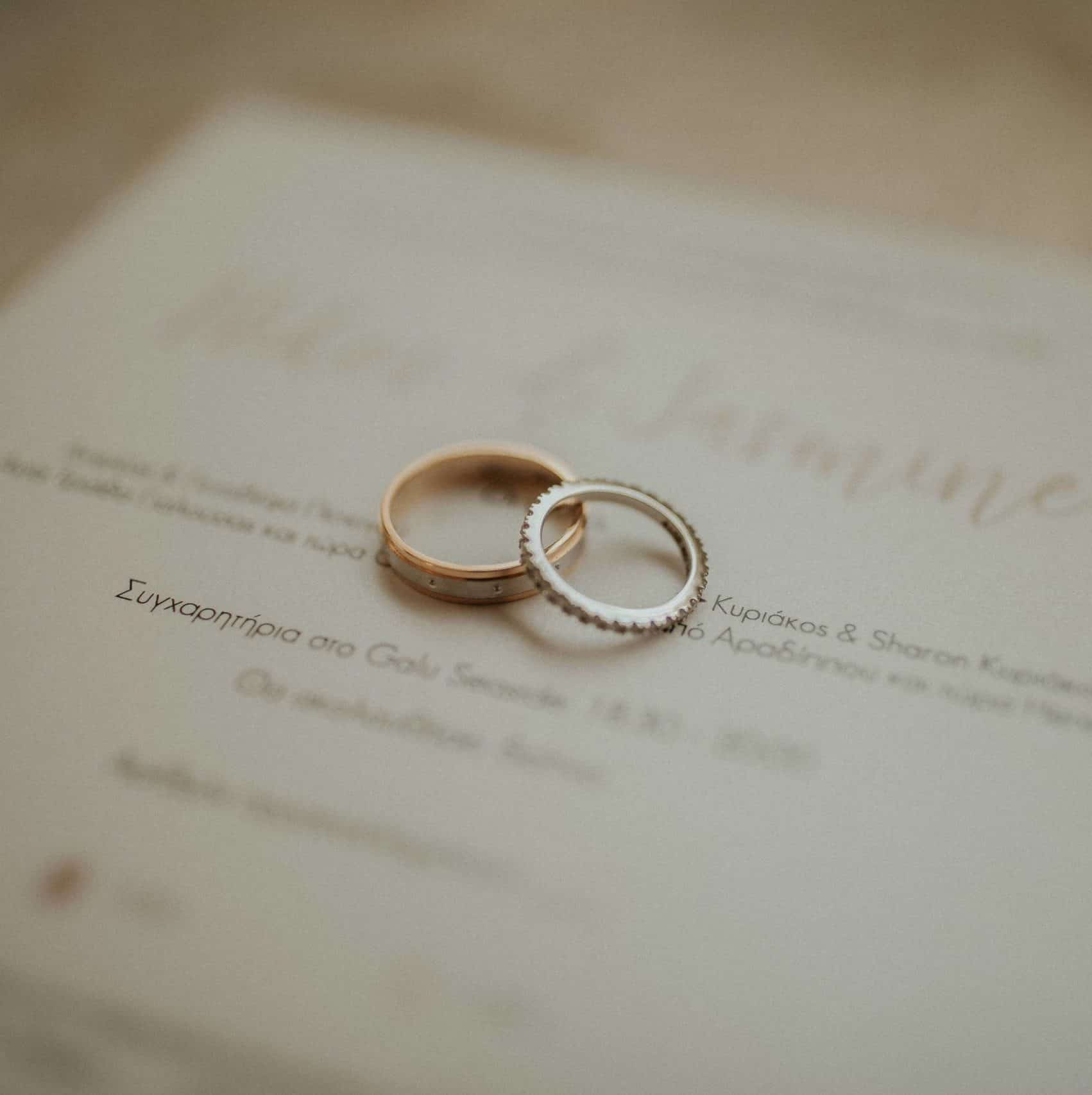 white-gold-seaside-2 wedding invitation and wedding rings